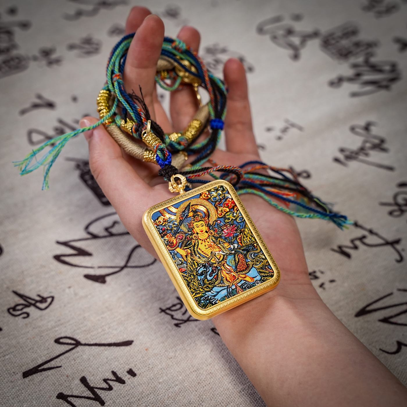 Mañjuśrī thangka gau pendant